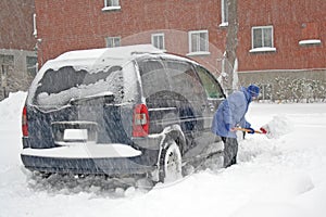 Man shoveling the snow.