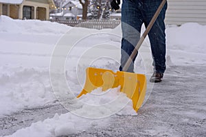 Man shoveling snow in winter