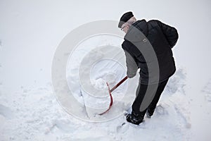 Man shovelling fresh snow