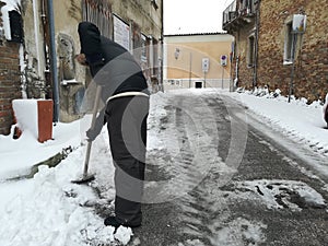 Man shovels snow