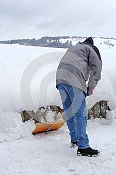 A man shovels snow