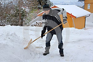 A man shovels snow