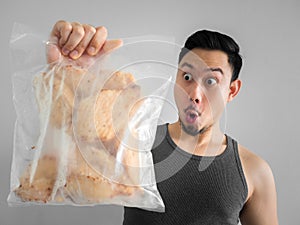 Man show chicken breast diet for healthy life.
