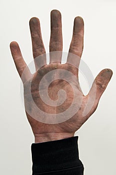 Man show his dirty hand with palms up