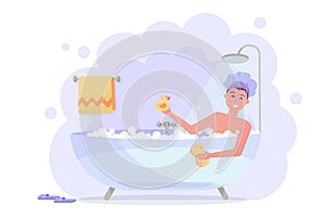 Man in shower cap taking bath with the shower. Happy funny guy in bubble bathtub, relaxing with yellow duck and washcloth. Bathtub