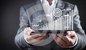 Man showing achieve business goals with growth graphs. Goals. Business