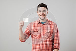 Man showing blank business card