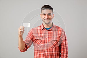 Man showing blank business card