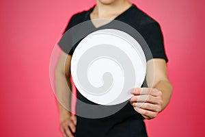 Man showing blank white rounded flyer brochure booklet. Leaflet