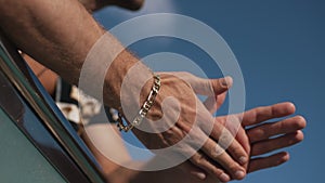 man showing a bracelet on his wrist