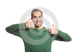 Man showing CALL ME gesture in sign language photo