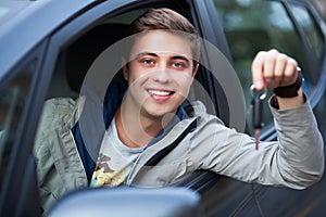 Man showing car key