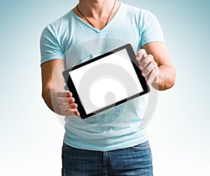 Man showing digital tablet computer screen in hands.