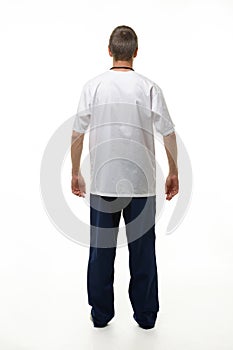 Man showing doctor`s clothes, back view, isolated on white background