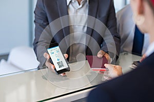 Man showing electronic flight ticket