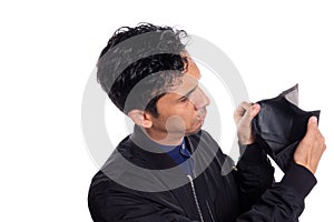 Man showing empty wallet isolated on white background. Sad young latino man with no money.