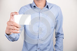 Man showing his blank business card