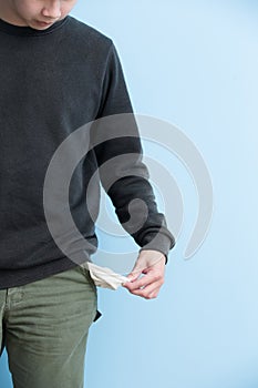 Man showing his empty pockets