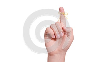 Man showing index finger with tied striped bow as reminder on white background, closeup