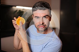 Man showing the interior of a fruit