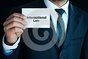 Man showing International Law text.