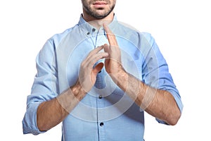 Man showing JESUS in sign language on white, closeup