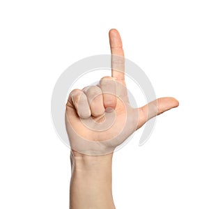 Man showing L letter on white background, closeup.