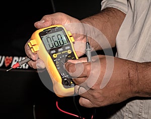 Man showing a multimeter.