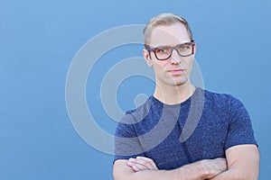 Man showing neutral expression closeup with arms crossed