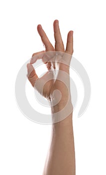 Man showing okay gesture against background, closeup of hand