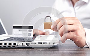 Man showing padlock. Credit card, internet, computer security