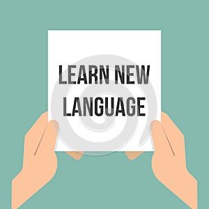 Man showing paper LEARN NEW LANGUAGE
