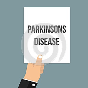 Man showing paper PARKINSONS DISEASE text