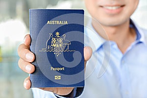 A man showing passport (of Australia)