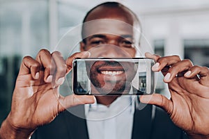 Man showing photo on his cell phone