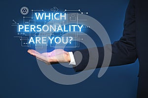 Man showing question Which personality are you? on virtual screen against dark blue background, closeup