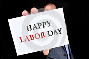 Man showing a signboard with the text happy labor day