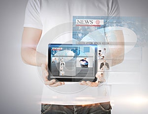 Man showing tablet pc with news