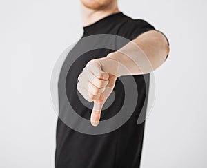 Man showing thumbs down