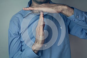 Man showing time out gesture.