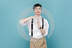 Man showing time out gesture, stop or limit hand sign, warning of deadline.