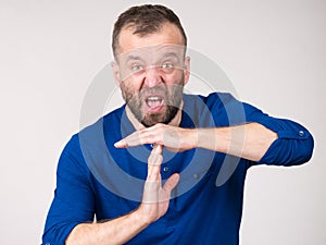 Man showing time stop gesture