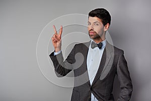 Man showing victory sign and looking at camera