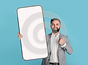 Man showing white empty smartphone screen, mockup