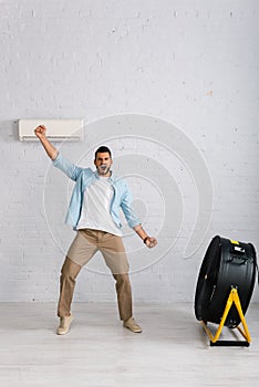 Man showing yeah gesture while standing