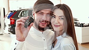 Man shows car key at the dealership