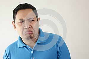 Man Shows Disgusted or Displeased Expression