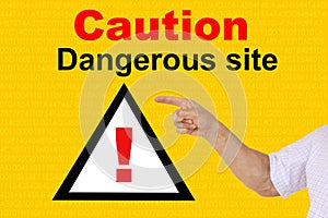 Man shows a hand on an exclamation mark on a triangle, concept attention on a yellow technological background, concept Deceptive