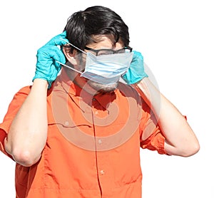 Man shows how to correctly wear the surgical mask to protect him