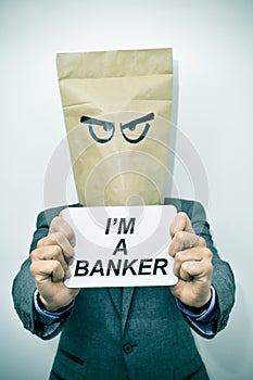 Man shows a signboard with the text I am a banker